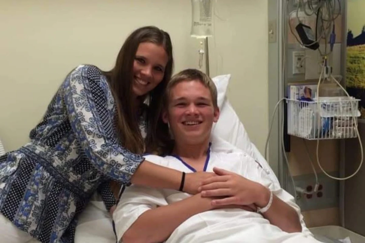 Corwin smiling from a hospital bed during his knee recovery